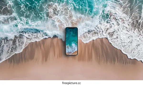 Smartphone on a Sandy Beach with Ocean Waves