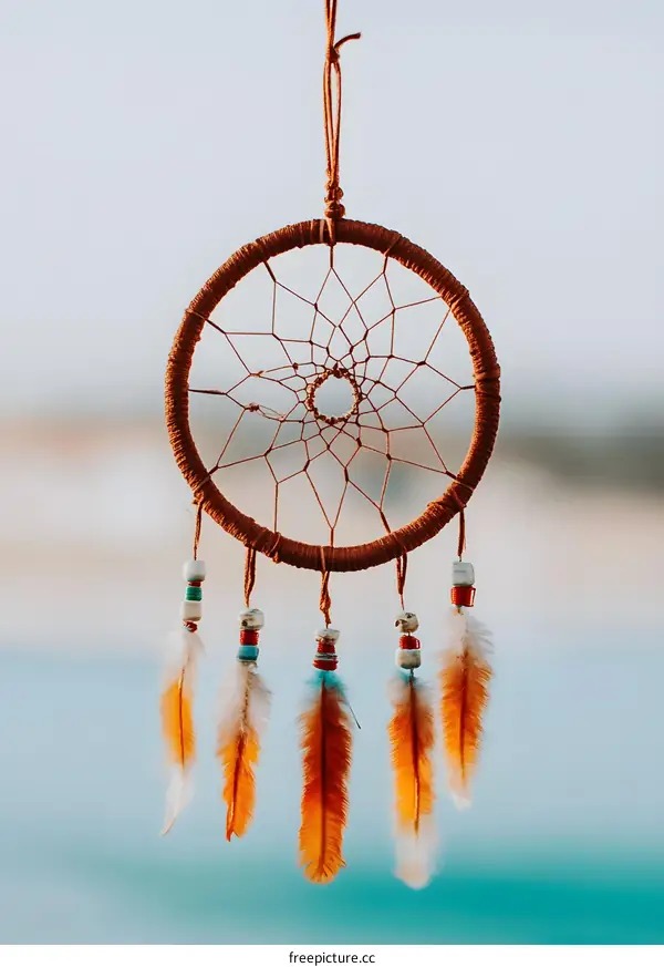 Dream Catcher With Feathers Hanging From It