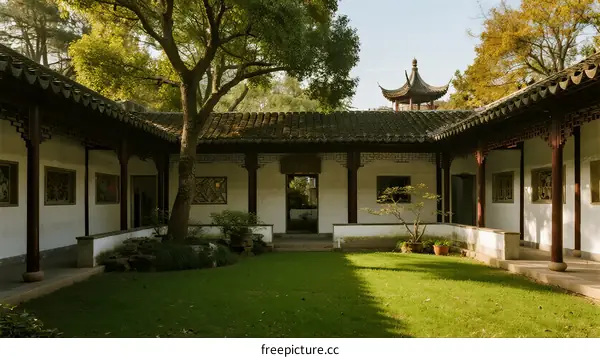 A Traditional Chinese Courtyard with Greenery and Pagoda