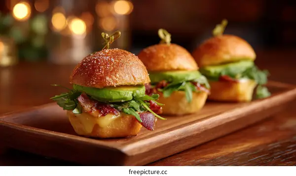 Miniature Avocado Bacon Sandwiches on a Wooden Tray