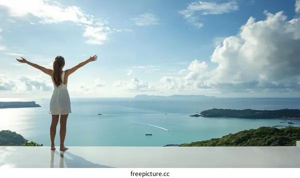 Woman Enjoying Ocean View with Open Arms