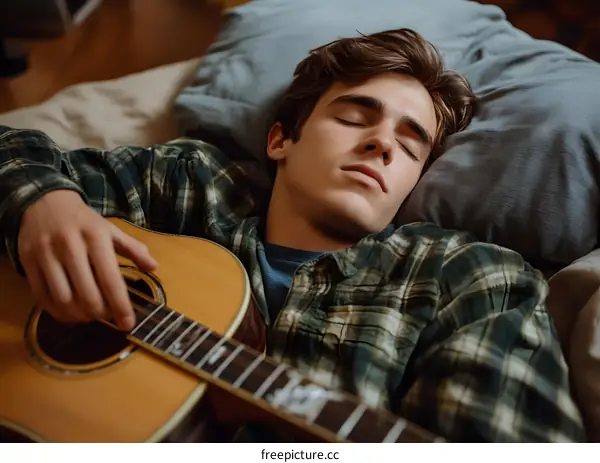 Young Man Sleeping with Acoustic Guitar