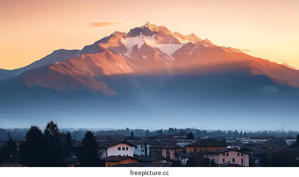 Majestic Mountain Sunrise Over Cityscape