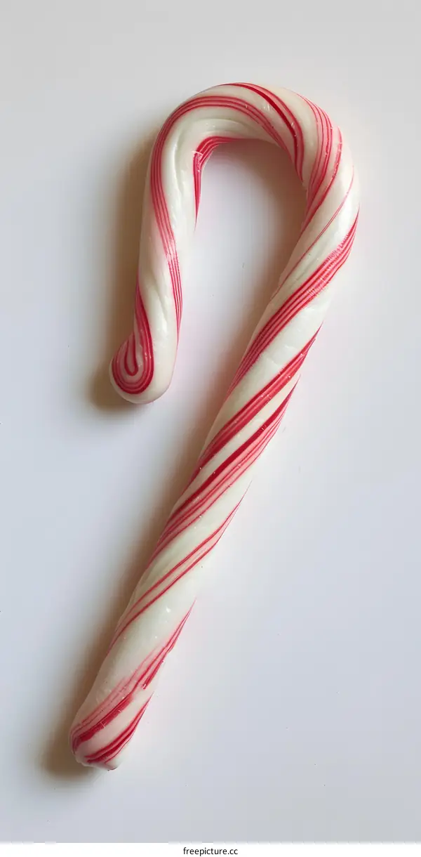 Red and White Candy Cane on White Background