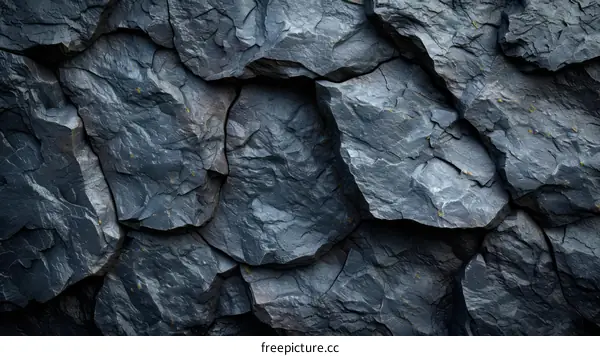 Dark gray rough rock surface texture background