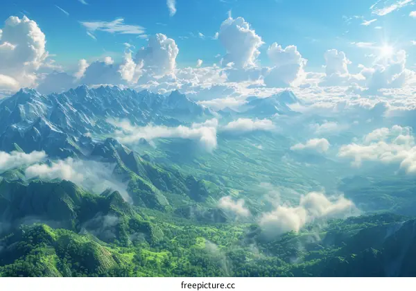 Aerial View of Lush Green Mountain Landscape with Snow Capped Peaks and Clouds