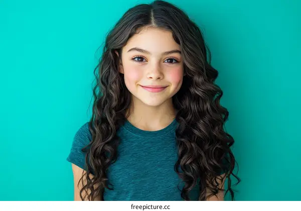 Portrait of a Curly-Haired Girl in Teal T-shirt