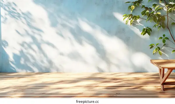 Empty Wooden Deck With Light Blue Wall And Plant Shadows