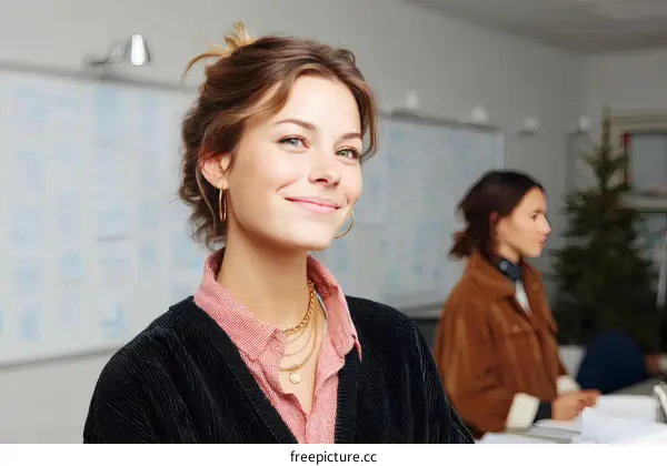 Smiling Young Woman in a Modern Office Setting