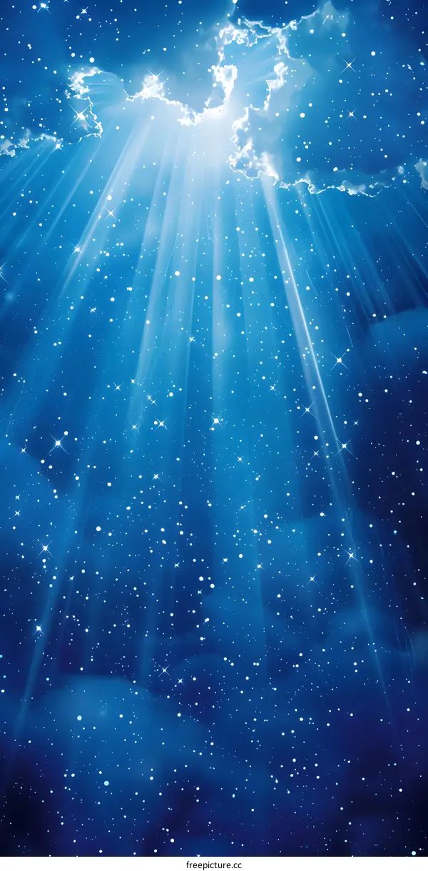 Blue sky with stars and rays of light shining through clouds