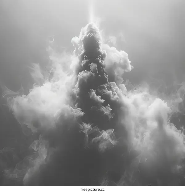 Black and white photo of a large, swirling cloud of smoke