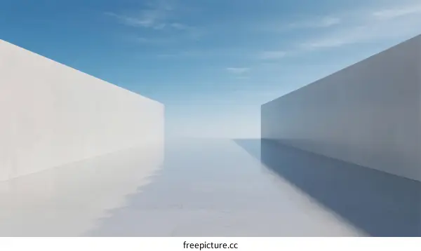 Two White Concrete Walls and Reflective Floor Under Clear Blue Sky