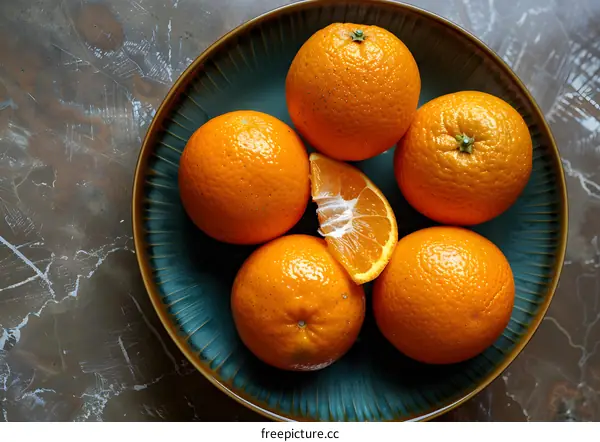 Closeup of Oranges in a Blue Plate