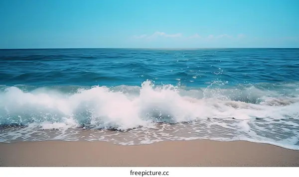 Blue Ocean Waves Crashing on Sandy Beach