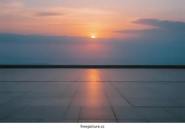 Sunset over a smooth paved area with a beautiful sky