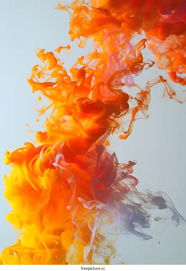 Orange and White Ink Swirling in Water Abstract Background