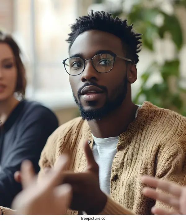 African American Man Speaking During Group Discussion