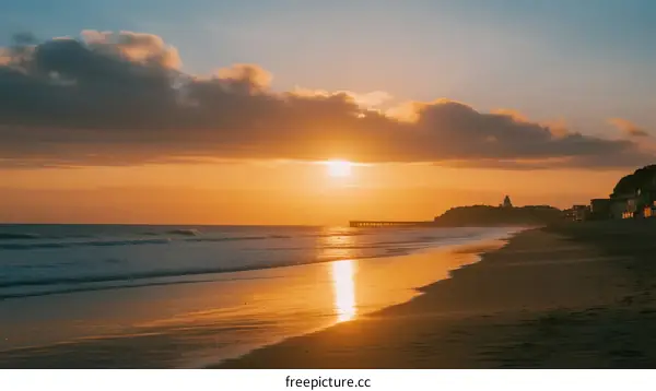 Beautiful Sunset over the Calm Beach with Golden Light Reflecting