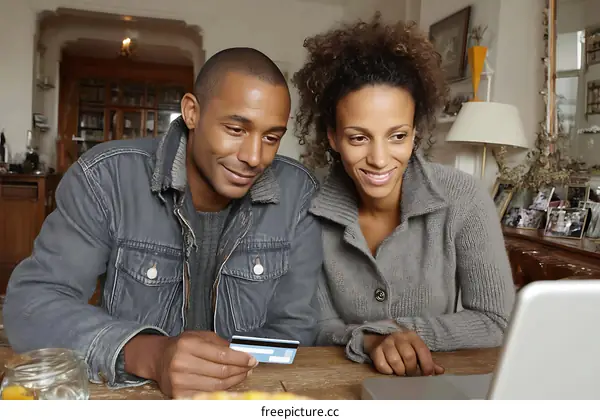 Couple using laptop for online shopping