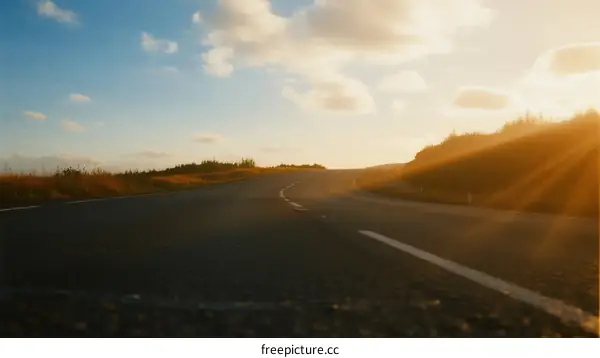 Sunlit Road with Clear Sky and Beautiful Scenery
