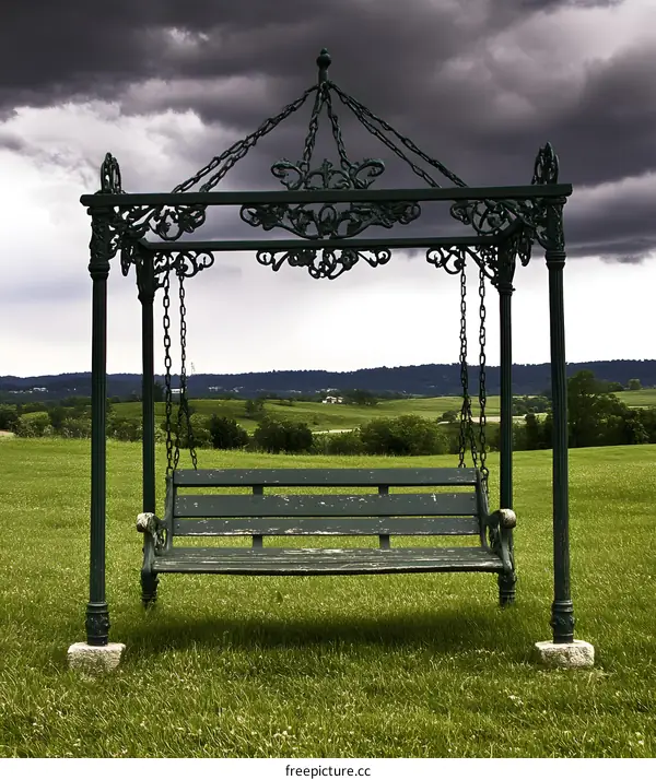 Green Swing Set Under Cloudy Sky