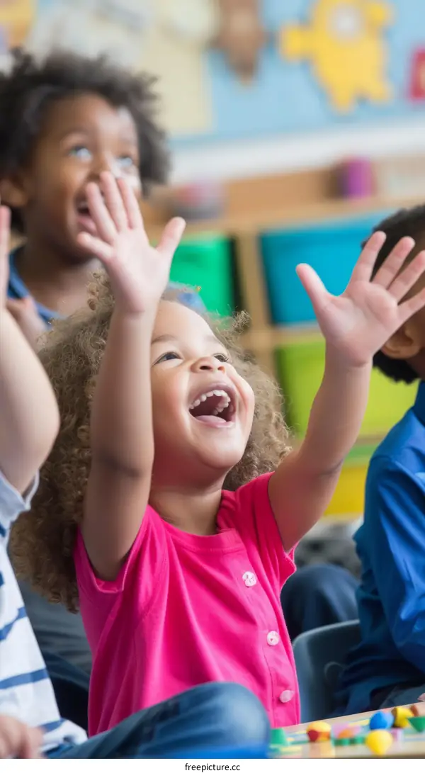 Little girl raising her hands in joy