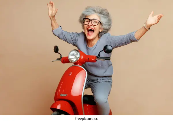 Happy Senior Woman Riding a Red Scooter