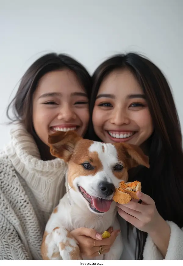 Two Asian women with a dog