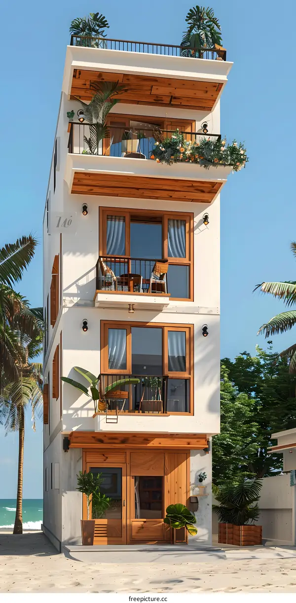 A three-story house with a modern design and a beautiful view of the beach