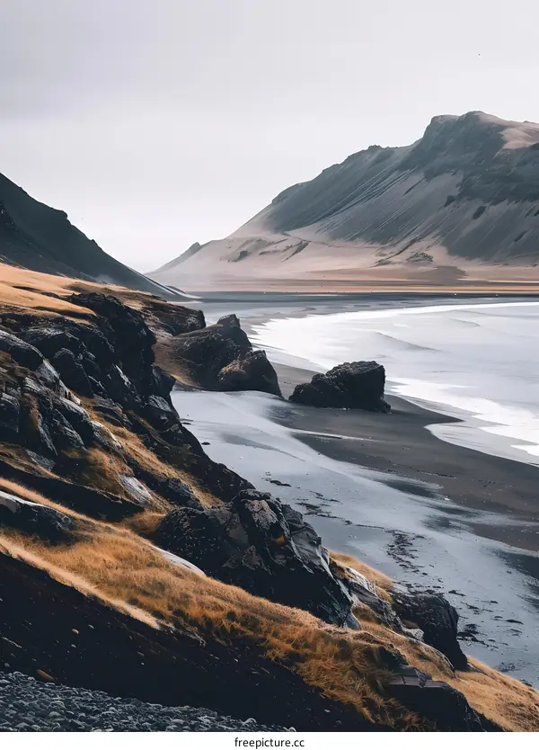 Black Sand Beach in Iceland with Dramatic Mountain Landscape