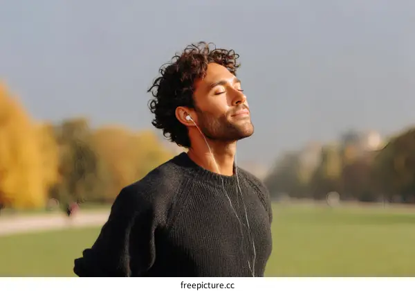 Man Listening to Music in Park