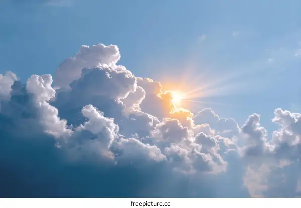 Stunning Sky with Fluffy Clouds and Golden Sunlight