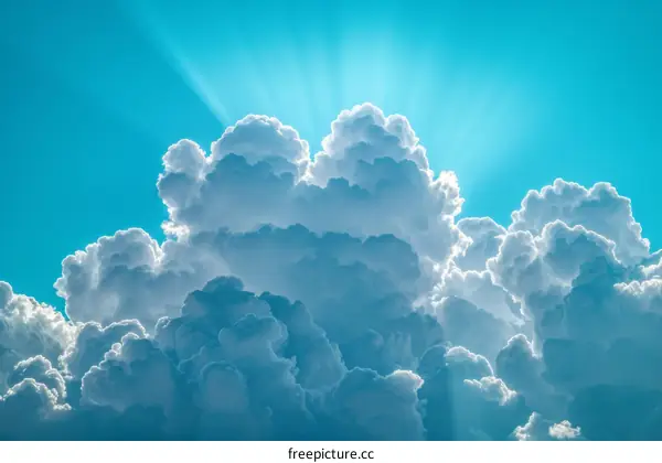 Bright white cloudscape with sun rays shining through the clouds