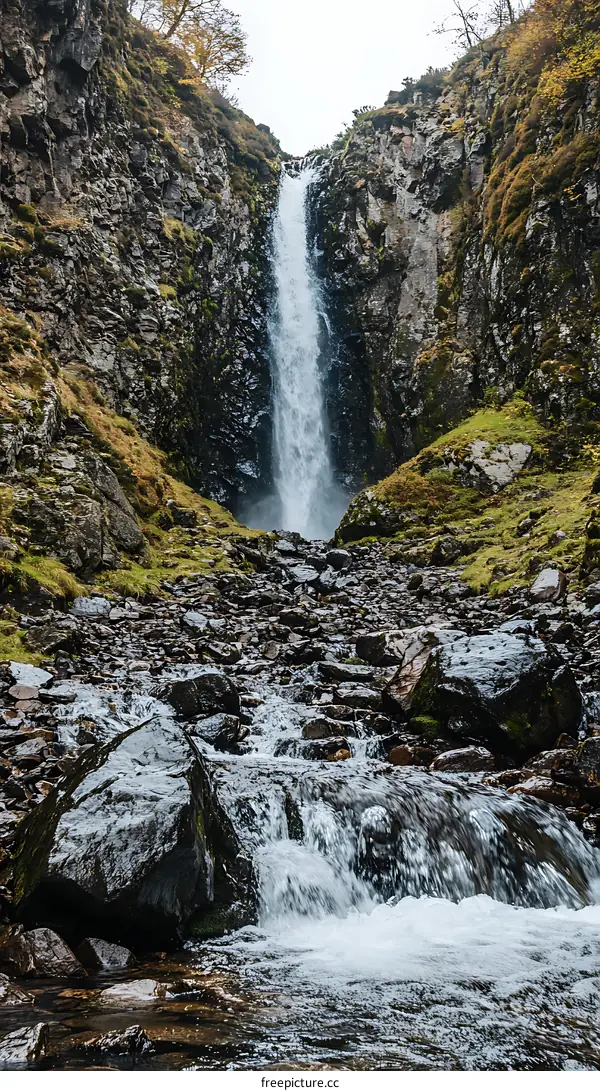 Waterfall Flowing Down Rocky Cliffs