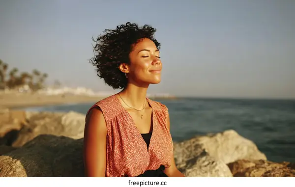 Relaxing Woman by the Ocean at Sunset