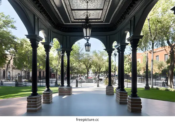 Green Metal Gazebo with Archway and Columns