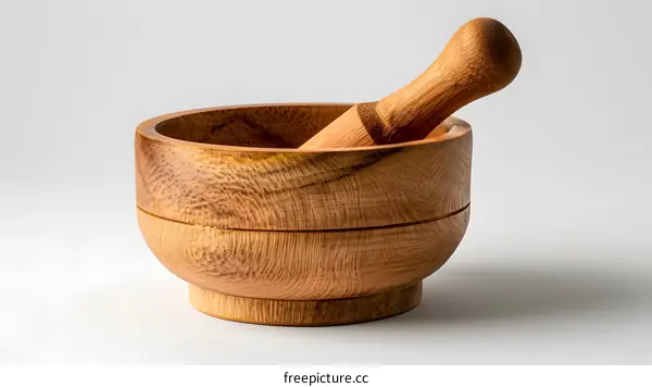 Wooden mortar and pestle isolated on white background