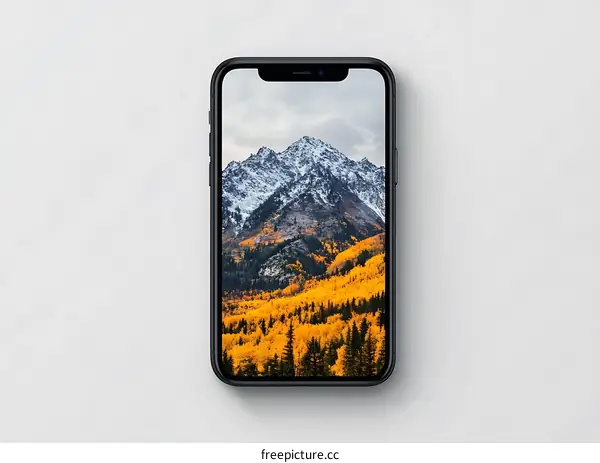 Smartphone with Mountain and Autumn Forest Wallpaper
