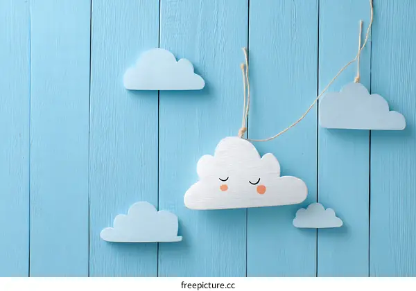 Cute Wooden Clouds Decor on a Light Blue Wooden Wall