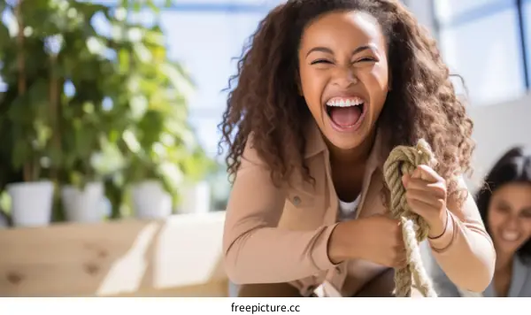 tug of war between two women in an office