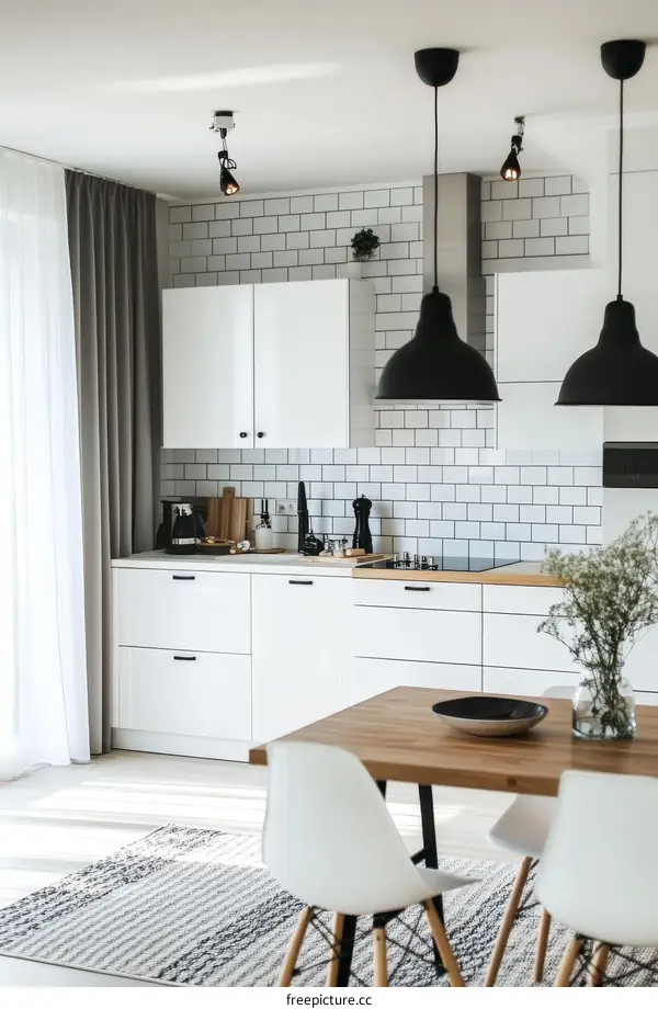 Modern White Kitchen with Wooden Table and Black Pendant Lights