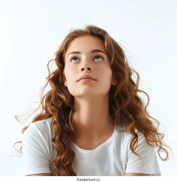 Young Woman with Curly Hair Looking Up