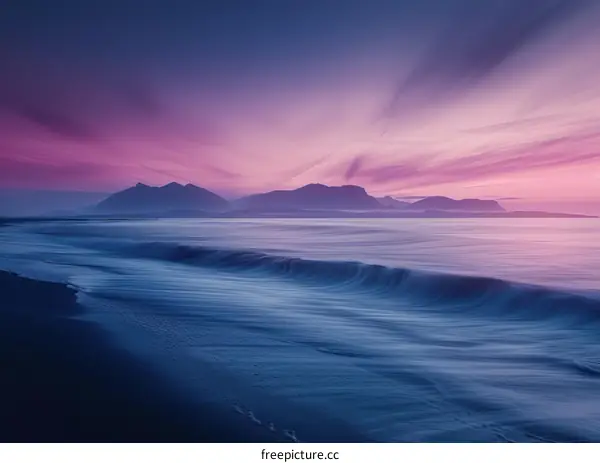 Pink and Purple Sunset Over Mountains and Ocean