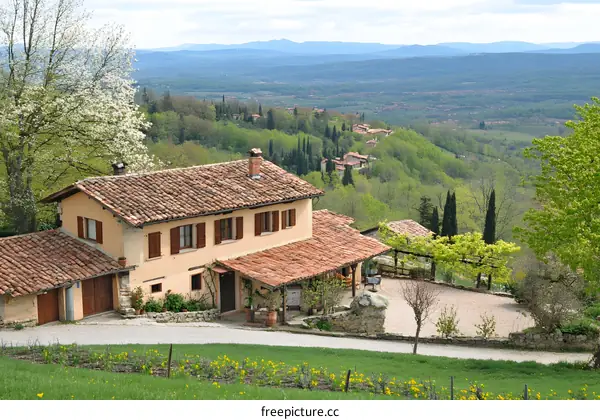 Italian Countryside Home with Red Tile Roof and Green Hills