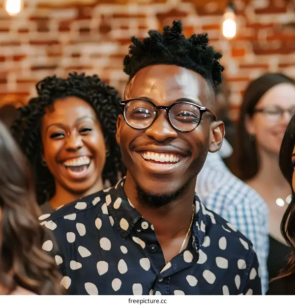 Happy Man Smiling with Friends in a Group