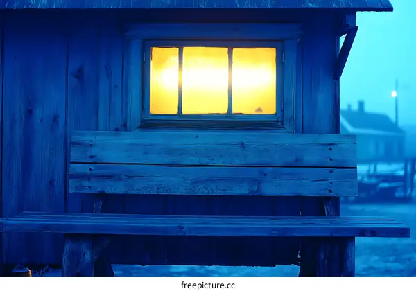 Blue Wooden Shack with a Luminous Window