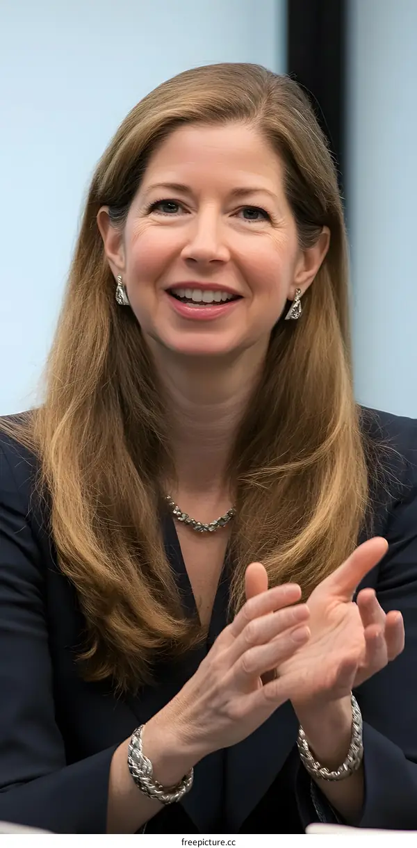 Portrait of a Woman with Blonde Hair Clapping