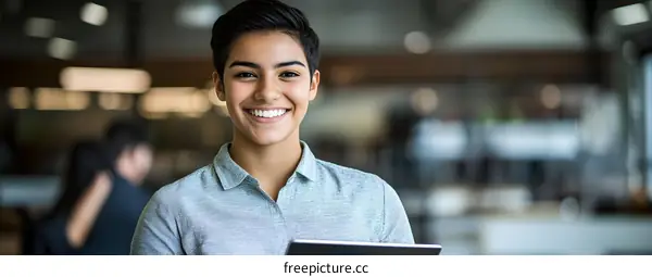 Smiling Young Woman With Short Hair Working In A Modern Office