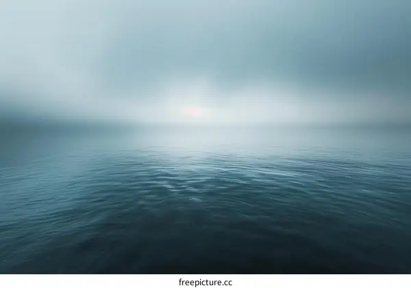 Serene Misty Lake with Distant Sun