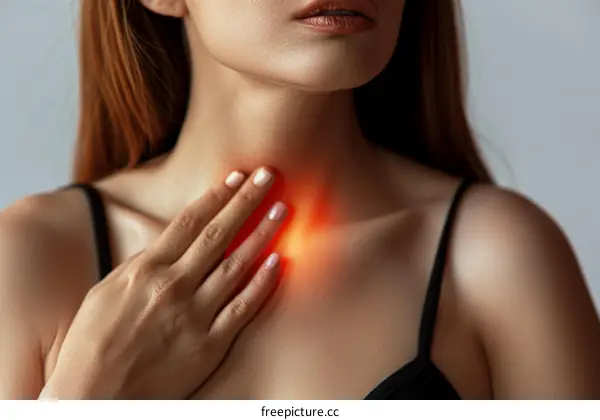 A woman is holding her neck and feels pain